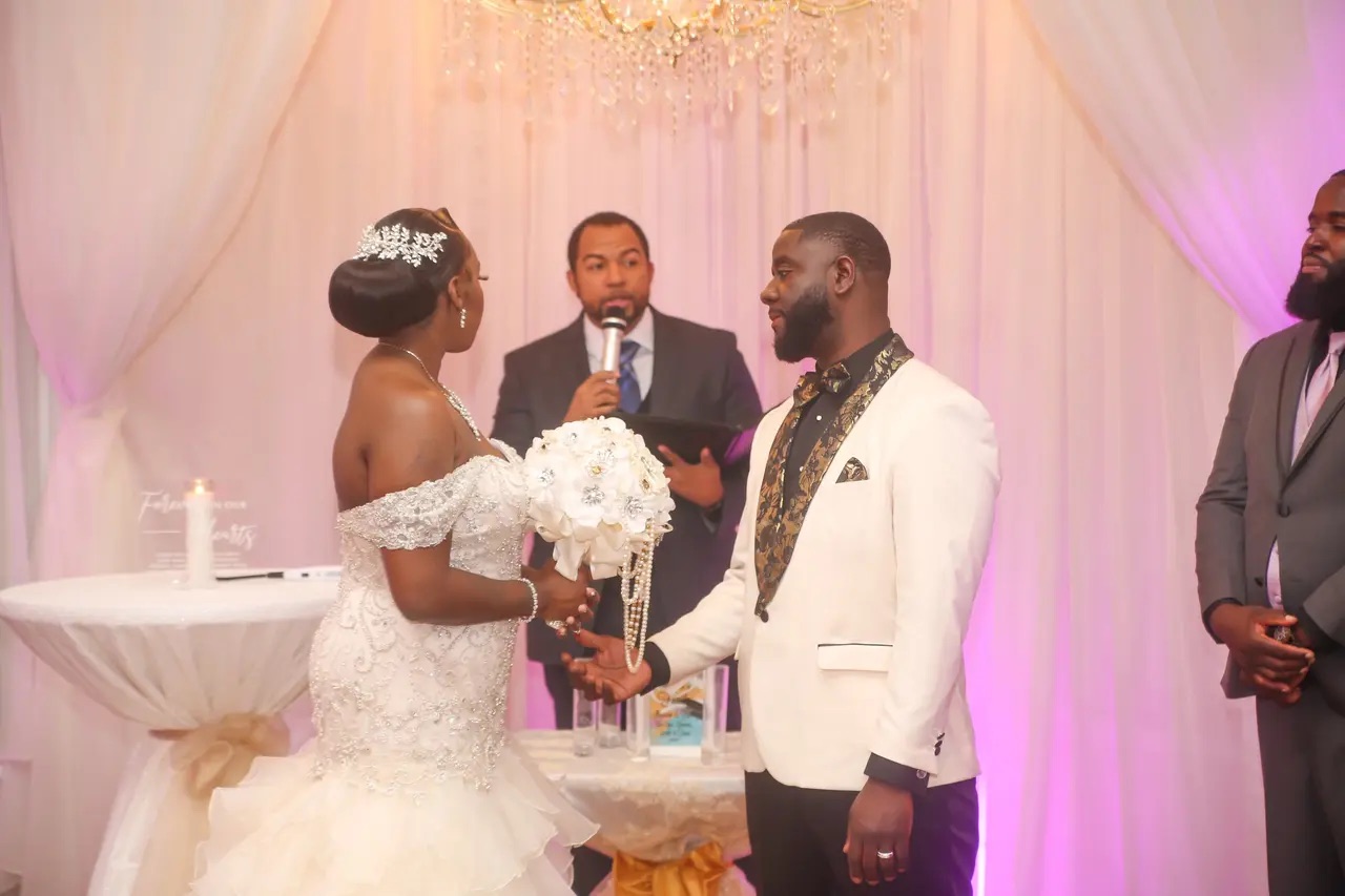 Wayde officiating an elegant Black couple's wedding ceremony