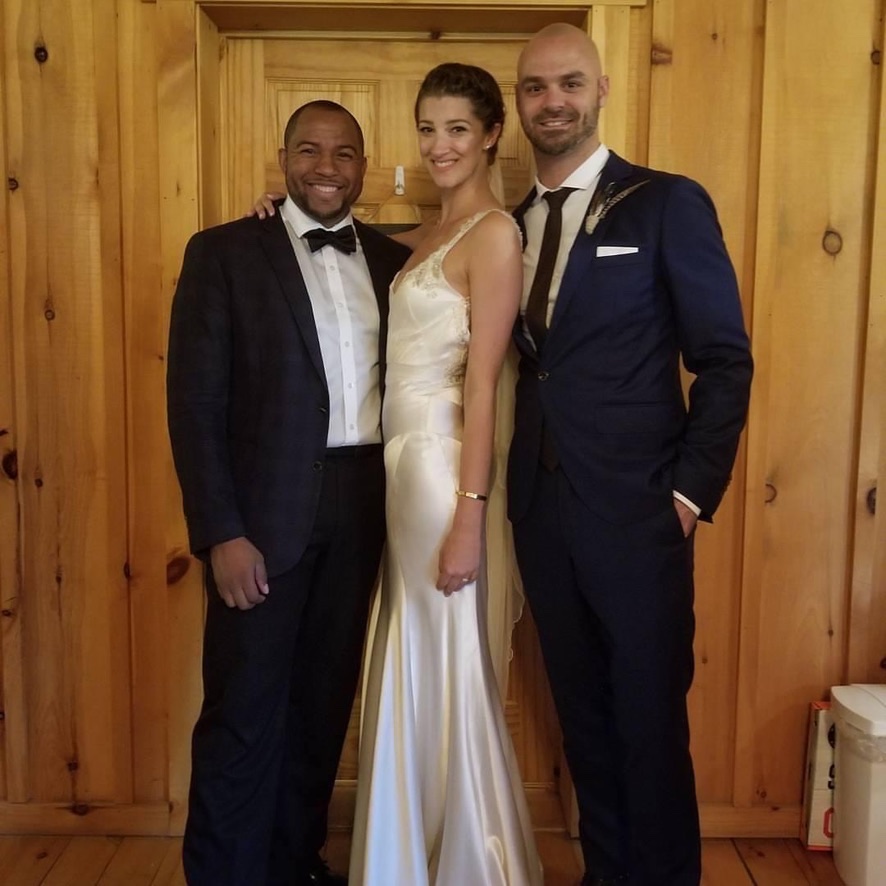 Wayde with newlyweds after an intimate rustic wedding
