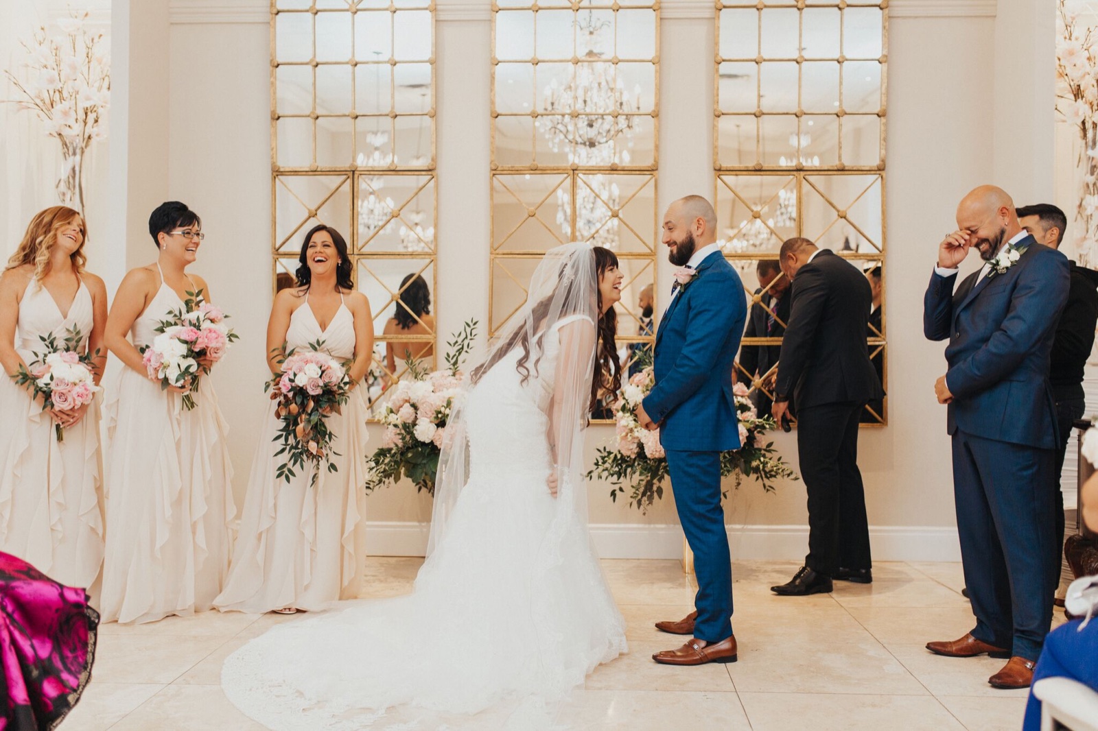 A joyful ceremony in an elegant gold-accented ballroom